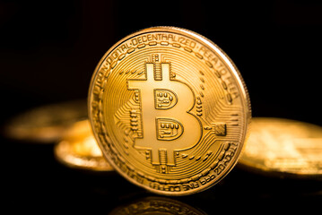 Bitcoin. Crypto currency Gold Bitcoin, BTC, Bit Coin. Macro shot of Bitcoin coins isolated on black background.