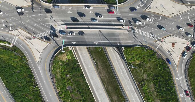 Hyderlapse / time lapse aerial, drone, early morning or afternoon video of a diverging diamond interchange (DDI), located in Woodbury, NY.	