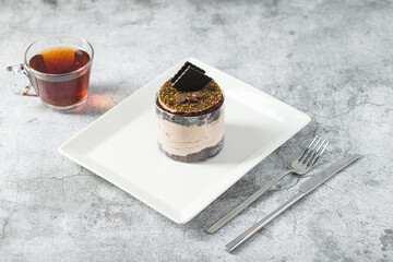 Chocolate single mini cake on a white porcelain plate