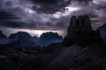 Thunder storm atmosphere viewed from Sextner Stein on Toblinger Knoten mountain range in the evening. Tre Cime, Dolomites, South Tirol, Italy, Europe.