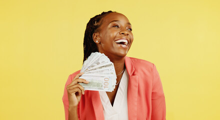 Money, fan and winner with a black woman in studio on a yellow background holding cash, finance or...