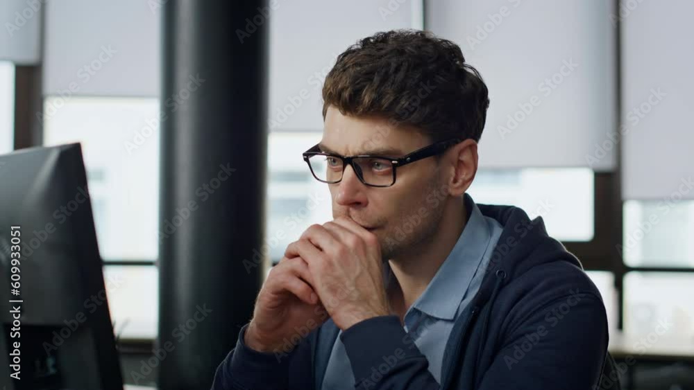 Aufkleber focused manager look screen at workplace closeup. serious programmer analyzing