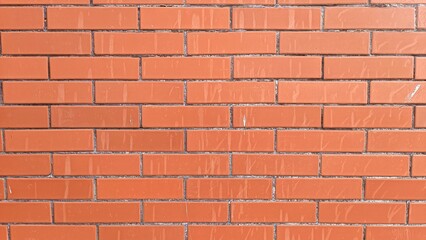 The surface of the orange-colored brick wall in the garden building