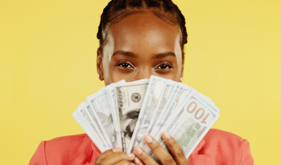 Portrait, happy black woman and money fan, dollar mockup, savings and profit for startup loan isolated on yellow background. Cash, budget and prize, success in financial freedom in studio with bonus.
