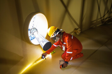 Male worker inspection at a surface painting color test of visual check flashlight record bottom...