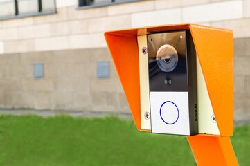 video intercom at the entrance to the parking area near a residential building or office - obrazy, fototapety, plakaty