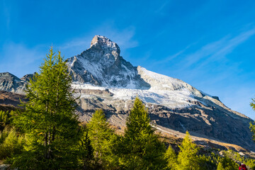 Fototapeta na wymiar Sunrise on Matternhorn summit. Most famous and highest mountain in Swiss Alps. Mountain top