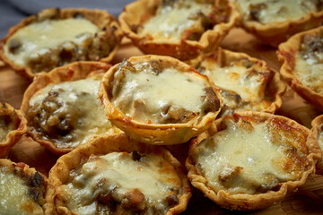 Julienne with chicken, mushrooms and cheese. Close-up of the pattern