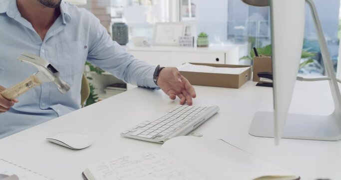 Computer keyboard, hammer smash and angry business man with mental health problem. Frustrated, stress and burnout of male employee with anger and workplace tech destruction from anxiety at company