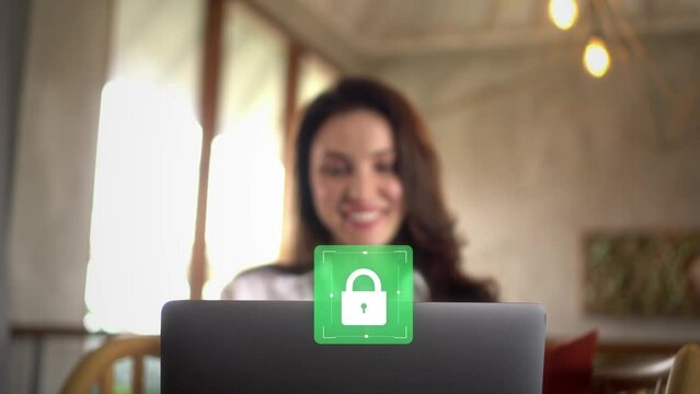 Woman smiling once her personal and work data is being protected from hackers and viruses by antivirus software. Secured home wi-fi connection protection