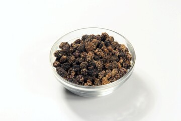 dried black mulberry fruit, Heap of dried black mulberry isolated on white
