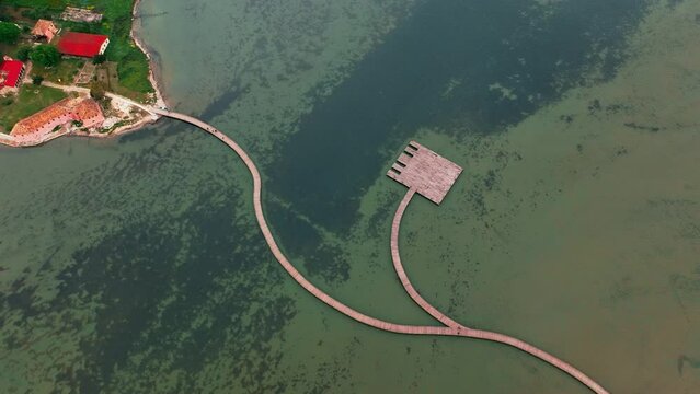 Drone aerial view on isolated Monastery of Saint Mary on Zvernec island. Narta Lagoon, Vlore, Albania