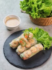 Fresh summer rolls with shrimp and vetgetables,Vietnamese food for healthy food concept with salad dressing
