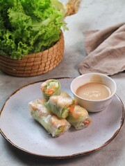 Fresh summer rolls with shrimp and vetgetables,Vietnamese food for healthy food concept with salad dressing
