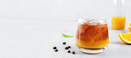 Bumble Coffee, Coffee with Orange Juice with Ice, Refreshing Drink on Grey Background