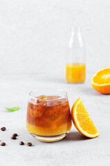 Bumble Coffee, Coffee with Orange Juice with Ice, Refreshing Drink on Grey Background