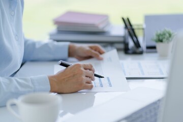 Small business accounting Businesswoman Accountant verify growing business with calculator. Accountancy