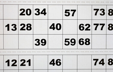 Close up photo of random numbers on paper bingo card