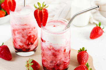 Korean Strawberry Milk, Strawberry Milkshake with Pureed Fresh Berries, Refreshing Drink on Bright Background