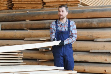 Joiner in uniform check boards on timber mill