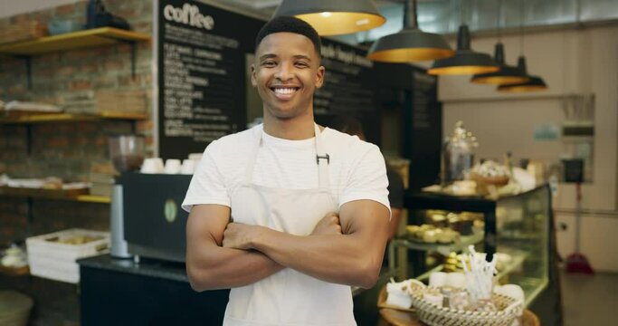 Bakery, happy and face of man in cafe ready for serving food, bread and pastry in small business. Restaurant, coffee shop and portrait of male waiter with crossed arms for service, help and startup