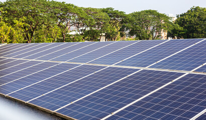 Close-up view of rows of large old blue solar panels, used as solar power generation materials,.