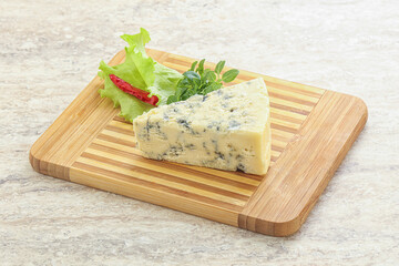 Blue cheese piece over board