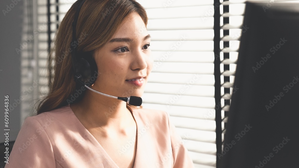 Aufkleber competent female operator working on computer and while talking with clients. concept relevant to bo