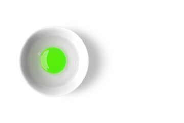 Green Egg Yolk On A White Bowl - Flat Lay View - Top View