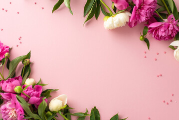 Obraz na płótnie Canvas Beauty of fresh flowers concept. Top view photo of empty space with bright pink and white peony flowers and buds with small confetti hearts on isolated pastel pink background with copy-space