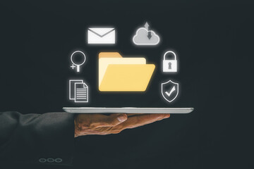 Document Management System (DMS), Business hand holding tablet with folder and document icon on virtual screen. .Software for archiving, searching and managing corporate files and information.