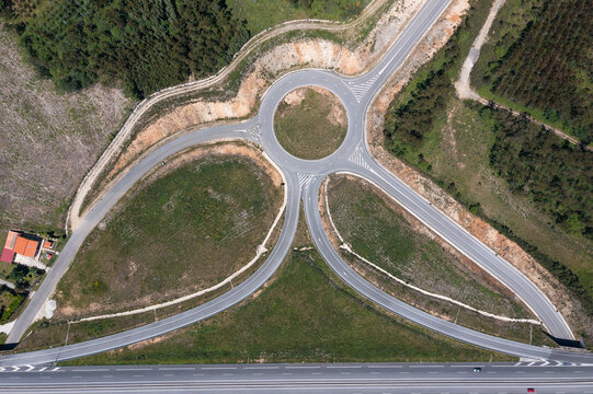 From above drone view of roads with exit points from main highway