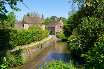 Fototapeta na wymiar Lacock ford Wiltshire England UK in the pretty village tourist destination near Chippenham 