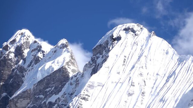 Jagged high peaks of langtang Himalaya mountain peak 
Long shot from Nepal, 2023
