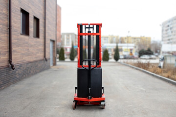 red empty forklift parked outdoors, cargo delivery and distribution, production warehouse