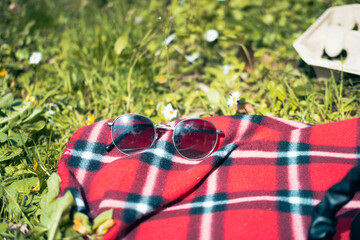 Sunglasses on a blanket