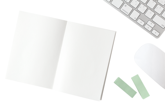 Blank notebook, white keyboard, white mouse, green sticky note