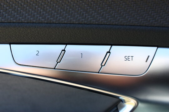 Car automatic seat memory control aluminum buttons close-up