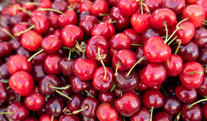 large quantities of vivid cherries on sale at the market