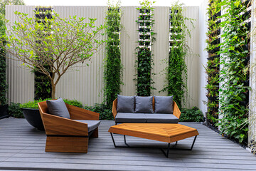 two stylish wooden chairs with cushions and a small wooden table at a balcony of a room in a...