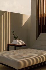 poolside bed when the light shines through the gap in the wooden wall