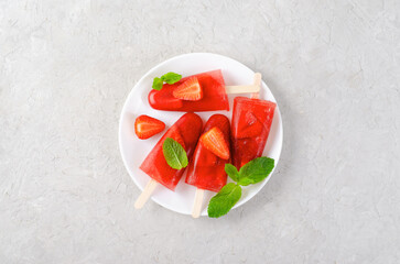 Refreshing Strawberry Popsicles, Ice Lolly with Fresh Strawberry and Mint on Bright Background