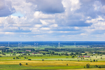 Landscape view with fields, farms and wind turbines