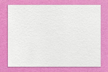 Texture of craft white color paper background with lilac border, macro. Structure of vintage dense kraft pink cardboard
