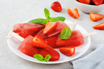 Refreshing Strawberry Popsicles, Ice Lolly with Fresh Strawberry and Mint on Bright Background