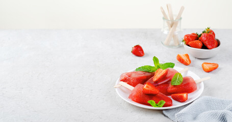 Refreshing Strawberry Popsicles, Ice Lolly with Fresh Strawberry and Mint on Bright Background