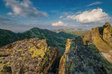 Summer day in the mountains with massive rocks, dramatic skies and majestic mountains. Mountain sunset in Slovakia mountain - Rohace, panorama of the Tatras Western Tatras.