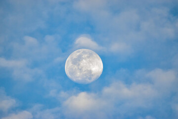 Naklejka na ściany i meble Day moon surrounded by clouds
