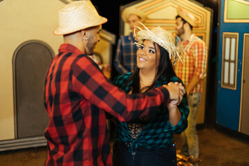 Couple dancing to Festa Junina, a lively Brazilian June festival with music, decorations, and joyful dances, showcasing Brazil's vibrant cultural traditions