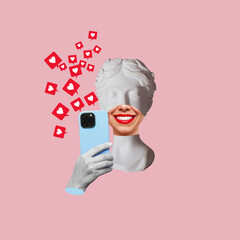 Antique smiling statue's head holding blue mobile phone with like symbols from social networks on pink color background. 3d trendy collage in magazine style. Contemporary art. Modern creative design